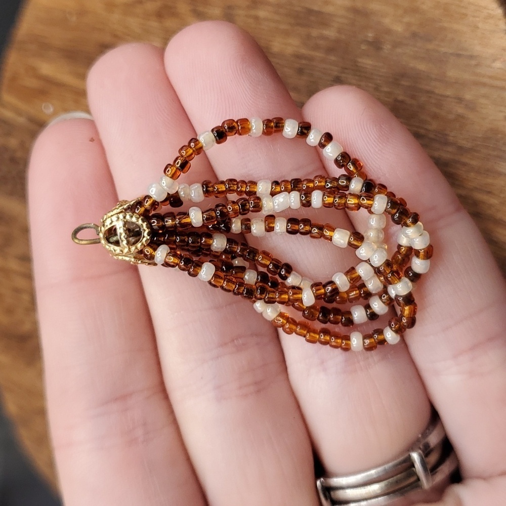 P116 Amber And Cream Seed Beaded Afghan Hoop Pendant
